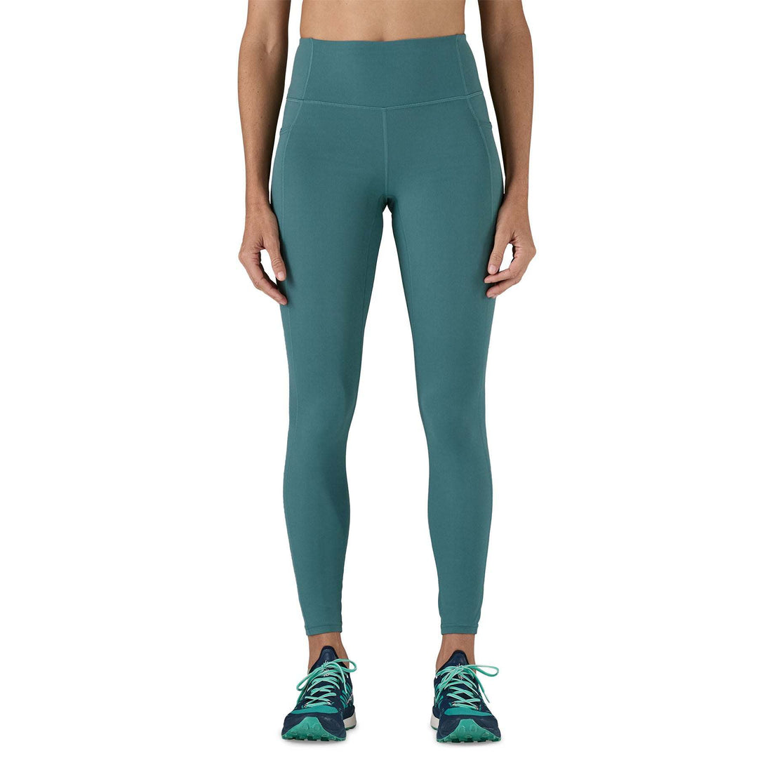 W's Maipo 7/8 Stash Tights in green, high-waisted, versatile leggings featuring recycled nylon, breathable fabric, and side pockets.