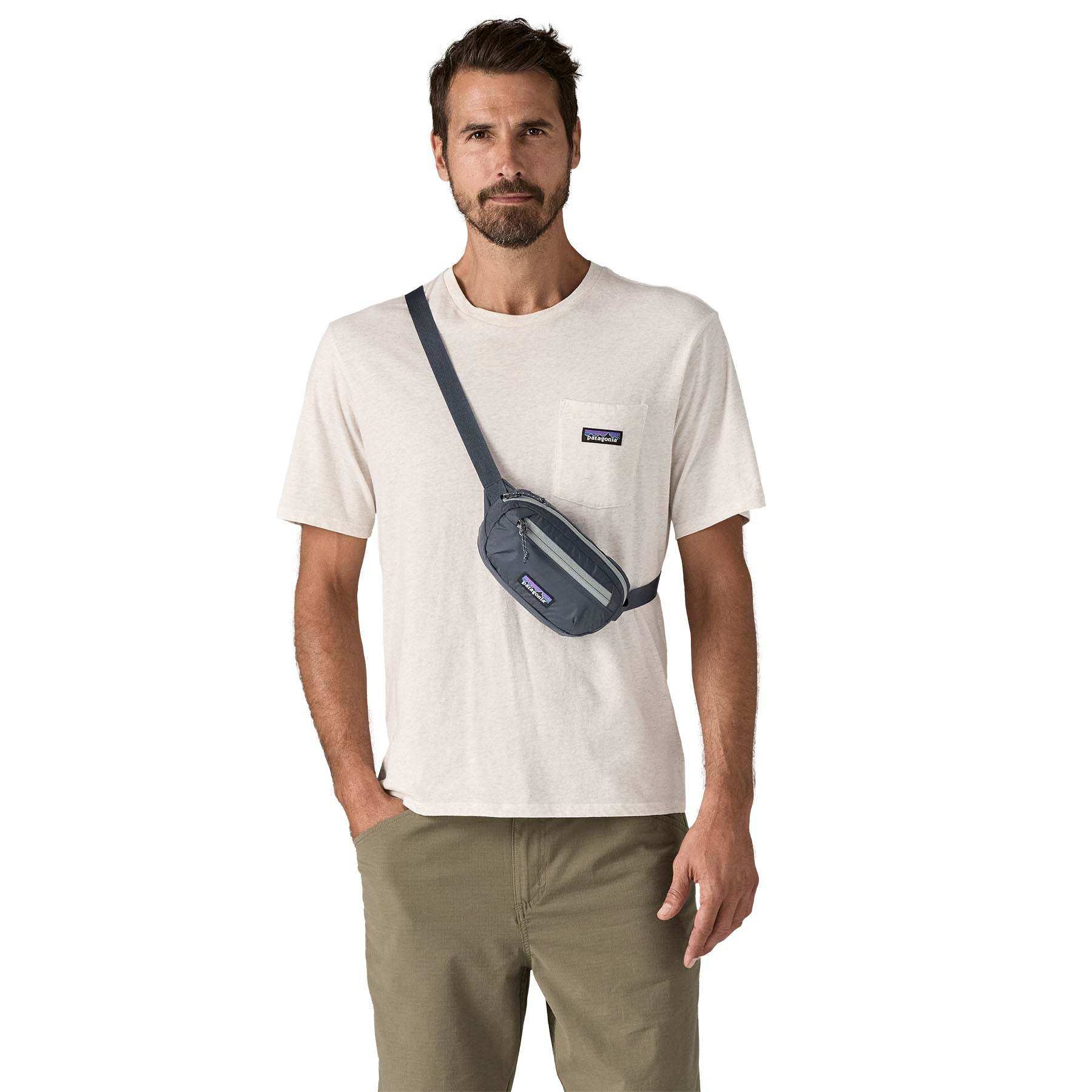 Terravia Mini Hip Pack worn crossbody by a man wearing a casual outfit, showing its lightweight and compressible design.