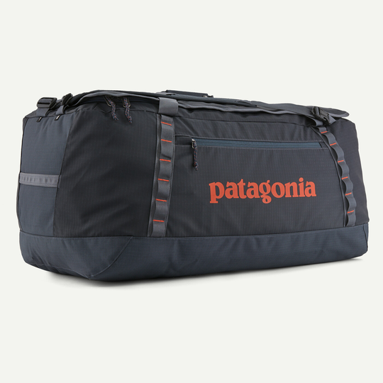 Black Hole Duffel 100L, large durable travel bag with recycled materials, ergonomic straps, and robust water-repellent design.