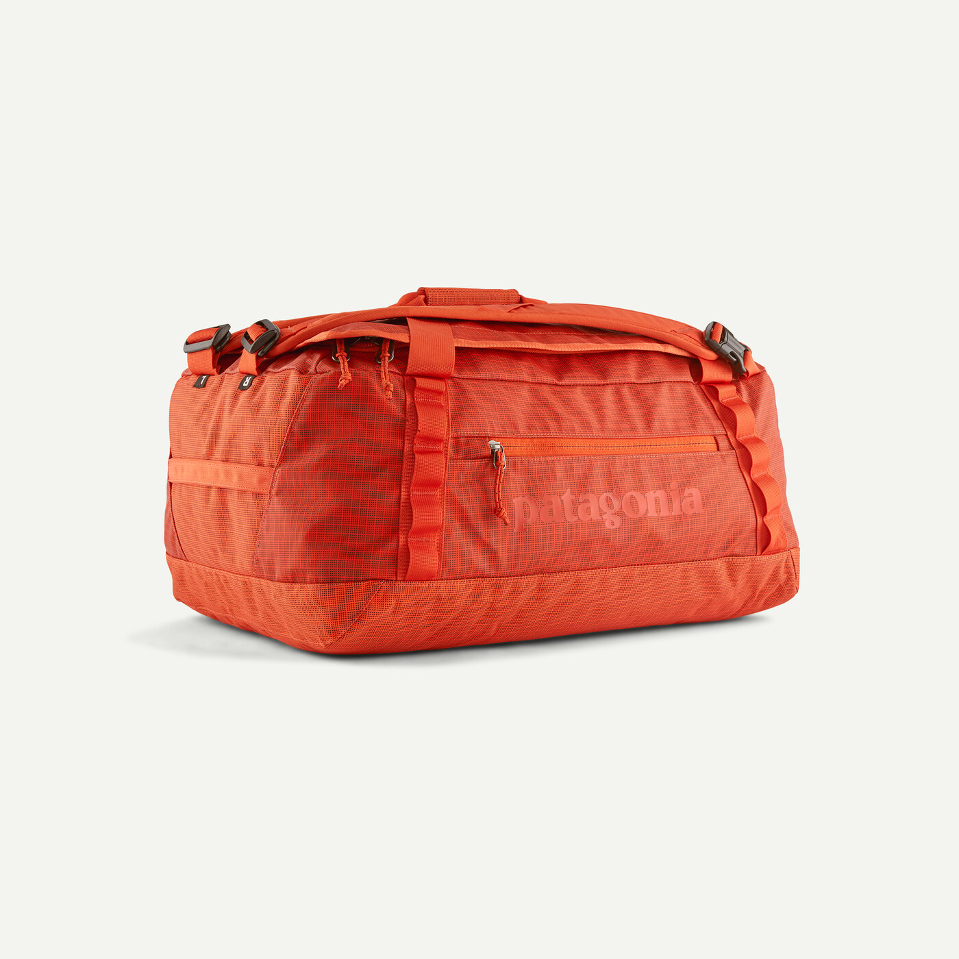 40L Black Hole Duffel orange bag with reinforced handles and ergonomic straps.