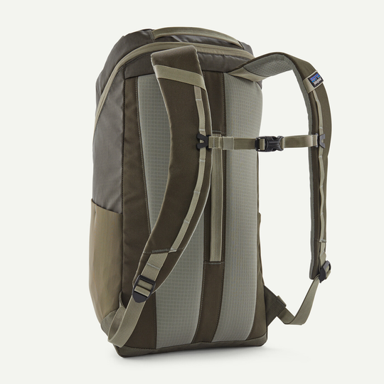 Black Hole Pack 25L backpack with recycled polyester, water-repellent, Fair Trade Certified, side bottle pockets, and trolley transport feature.