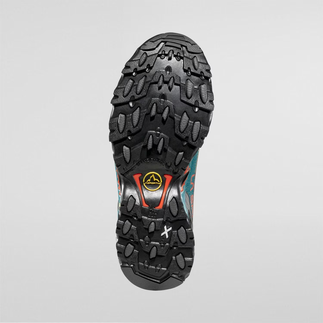 Ultra Raptor II Woman trail running shoe sole with rugged tread pattern for off-road use.