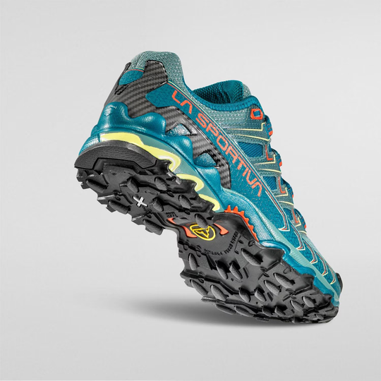 Ultra Raptor II Woman trail running shoe with blue mesh, cushioned platform, and sturdy tread for long-distance off-road runs.