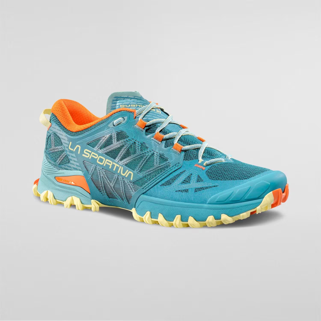 Bushido III Woman shoe in vibrant blue and orange, designed for optimal grip and stability on various terrains.