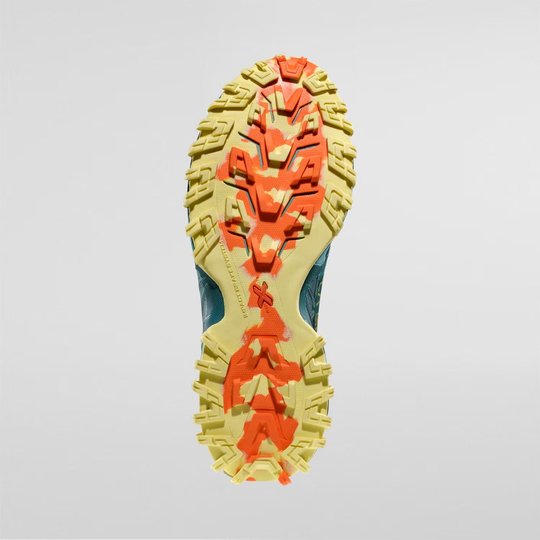 Bushido III Woman trail running shoe sole with aggressive tread design for enhanced grip on all terrains.