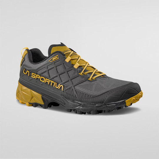Akyra II Gtx trail running shoe with yellow accents, 3D Grid™ construction, Gore-Tex, and durable sole design.