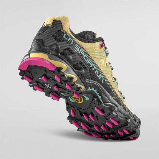 Trail running shoe Ultra Raptor II Woman in yellow and black, featuring a breathable air-mesh upper and durable FriXion White sole.