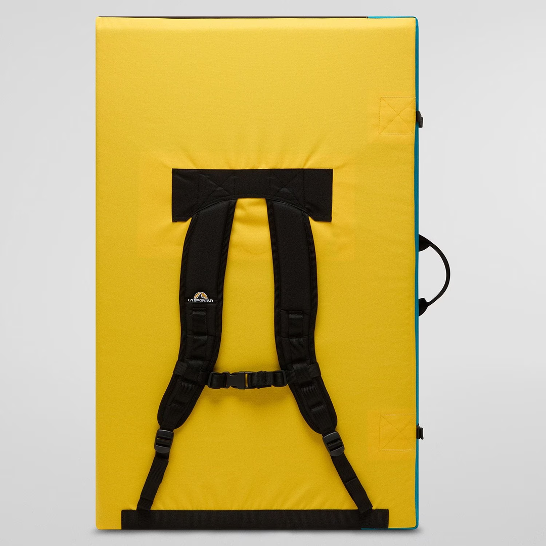 Bouldering crash pad Allez with ergonomic straps, durable yellow exterior, and compact design for outdoor use.
