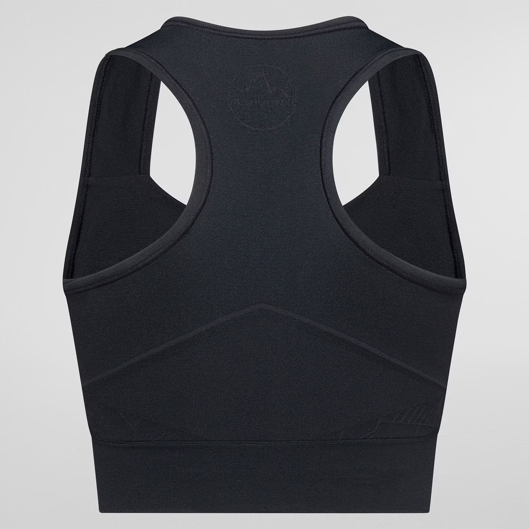 Eco-friendly black seamless sports bra with body-mapped structure for support and breathability.