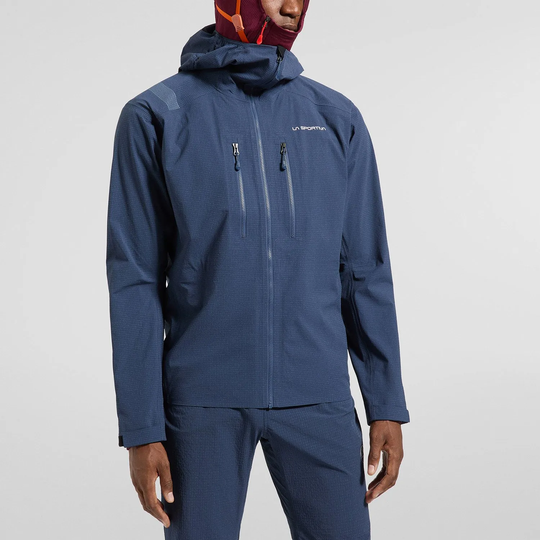 Giacca Helixir Shell Jkt M, impermeabile a 3 strati, colore blu, tessuto Spectra® resistente, con cappuccio compatibile con casco e maniche preformate.