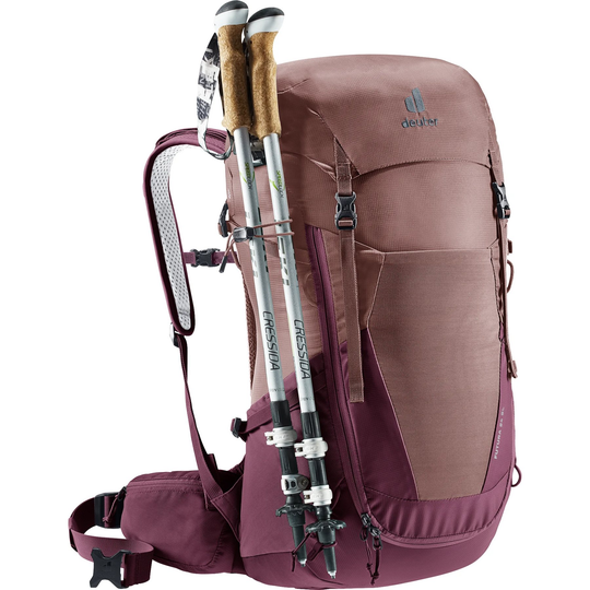 Futura 24 SL women's hiking backpack in plum, designed for comfort and ventilation with adjustable straps, multiple compartments, and pole attachment.