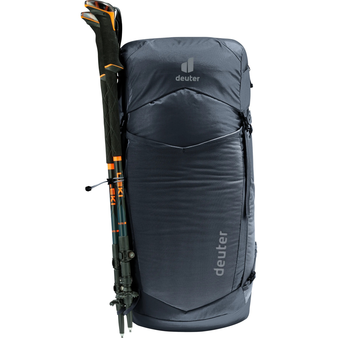 Lightweight Speed Lite Pro 30 backpack with hiking poles attachment, ideal for mountain hiking.