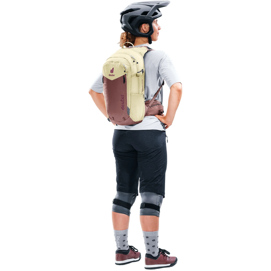 Compact 12+3 SL bike backpack with Airstripes system, hydration compartment, helmet attachment; worn by cyclist.
