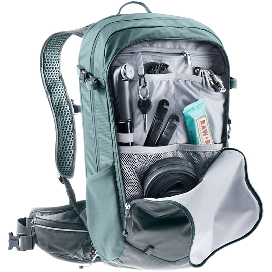 Compact 14+3 bike backpack with Airstripes system, hydration compartment, tool organizer, helmet attachment, expandable volume, and reflective details.