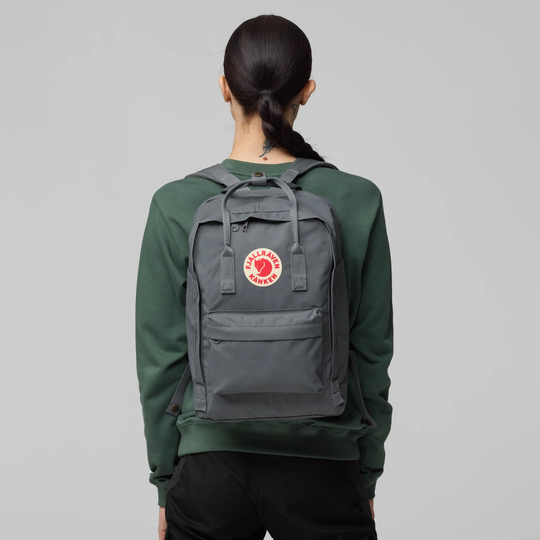 Kånken Laptop 15" backpack with padded laptop compartment, gray color, worn on back.