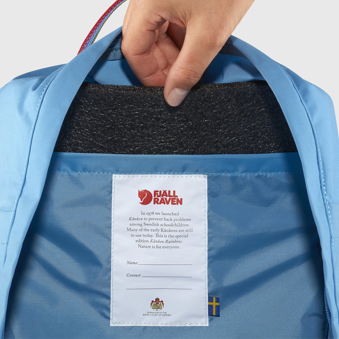 Blue Kånken Rainbow backpack interior with Arctic Fox initiative tag.