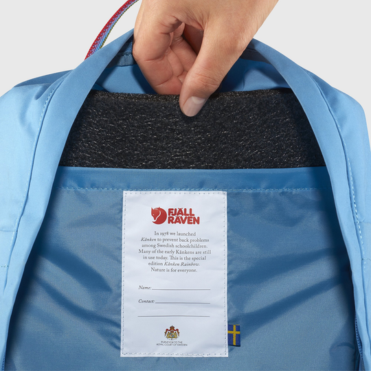 Blue Kånken Rainbow backpack interior with Arctic Fox initiative tag.