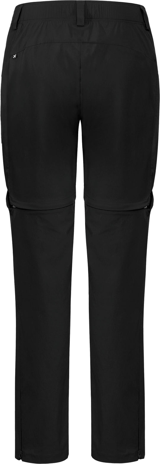 Donna che indossa pantaloni Montura Rise Zip Off leggeri e traspiranti durante un'escursione estiva
