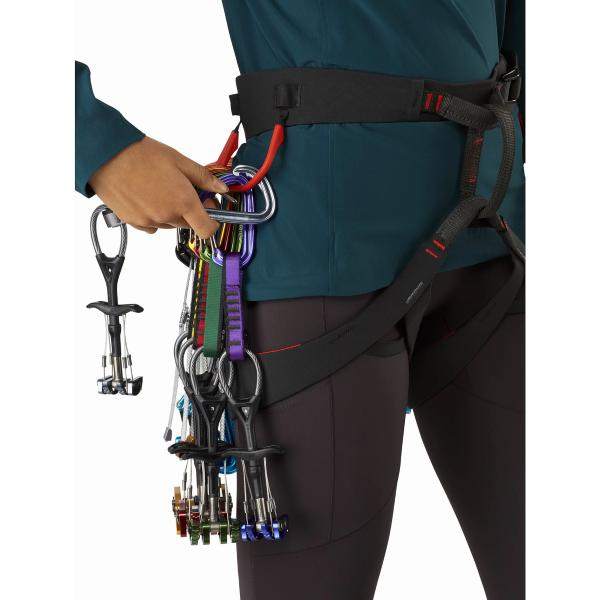 Women's climbing harness with gear, featuring the advanced C-Quence Harness design.