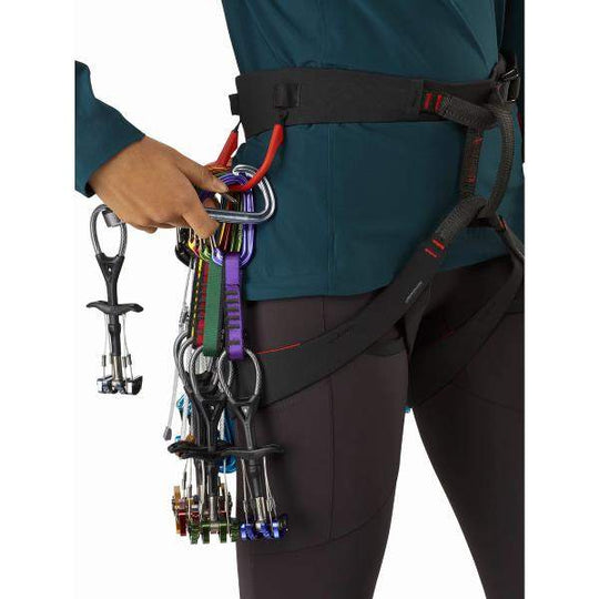 Women's climbing harness with gear, featuring the advanced C-Quence Harness design.