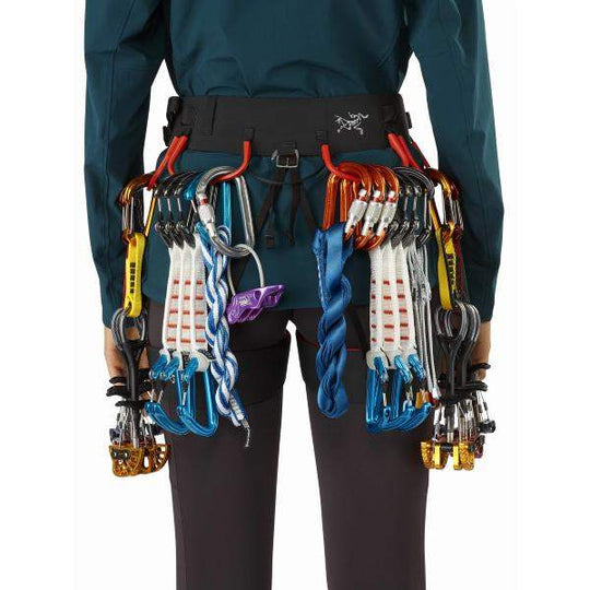 Women's C-Quence Harness with climbing gear showcasing Warp Strength Technology for comfort and performance.