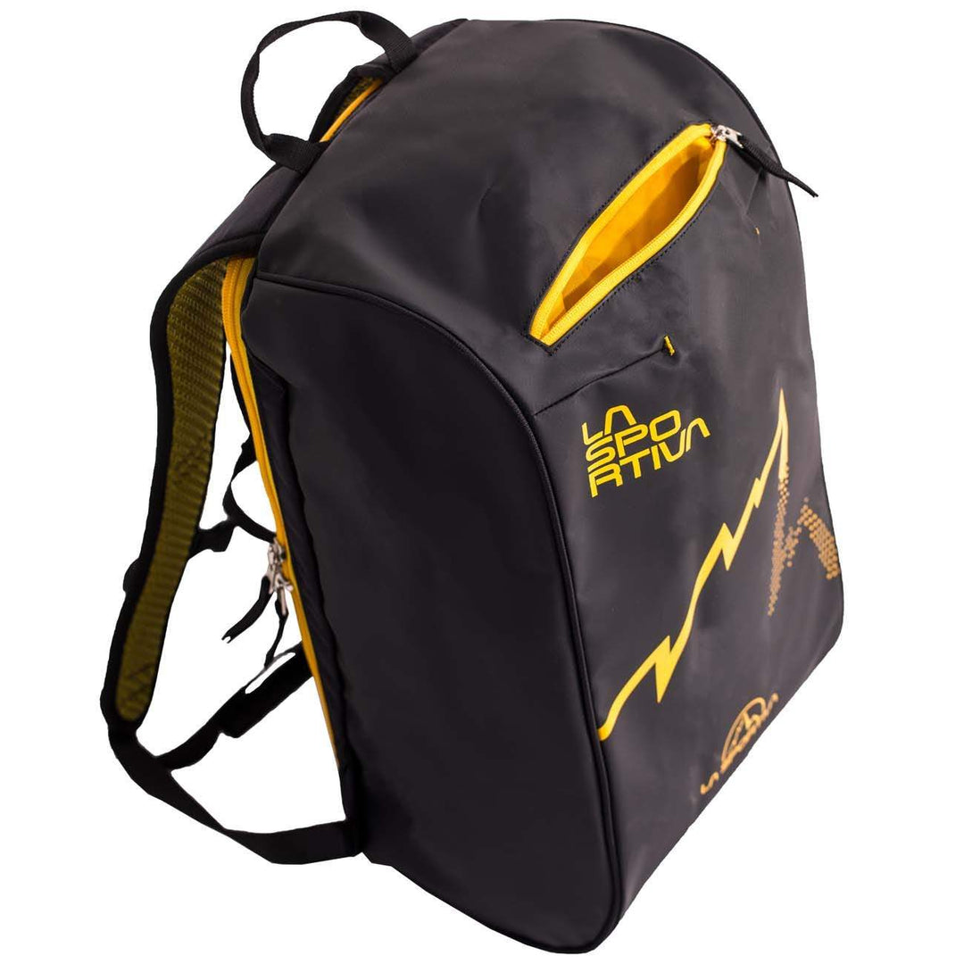Climbing bag in black nylon and PVC with yellow accents, featuring back zip access and internal pocket.