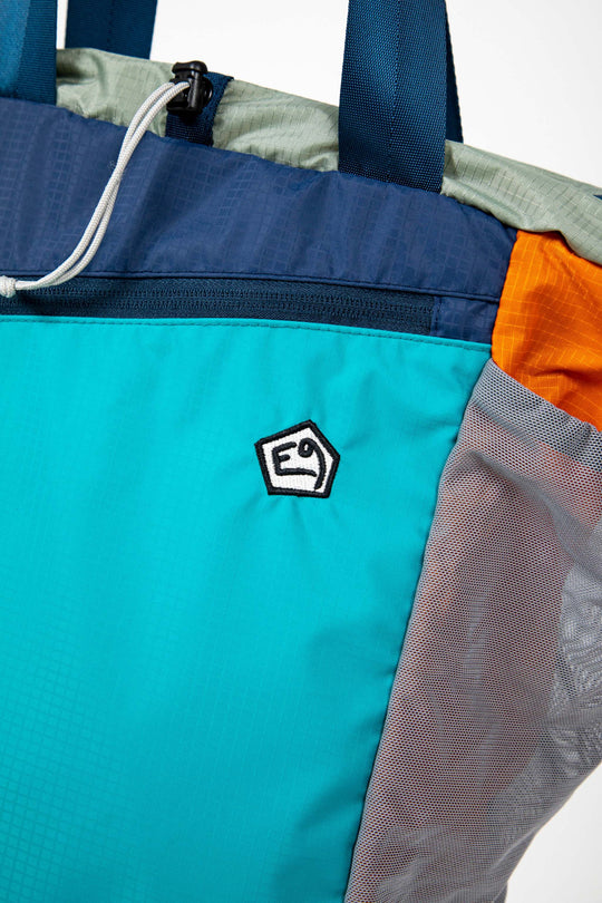 Multicolored technical backpack with E9 logo and durable fabric.