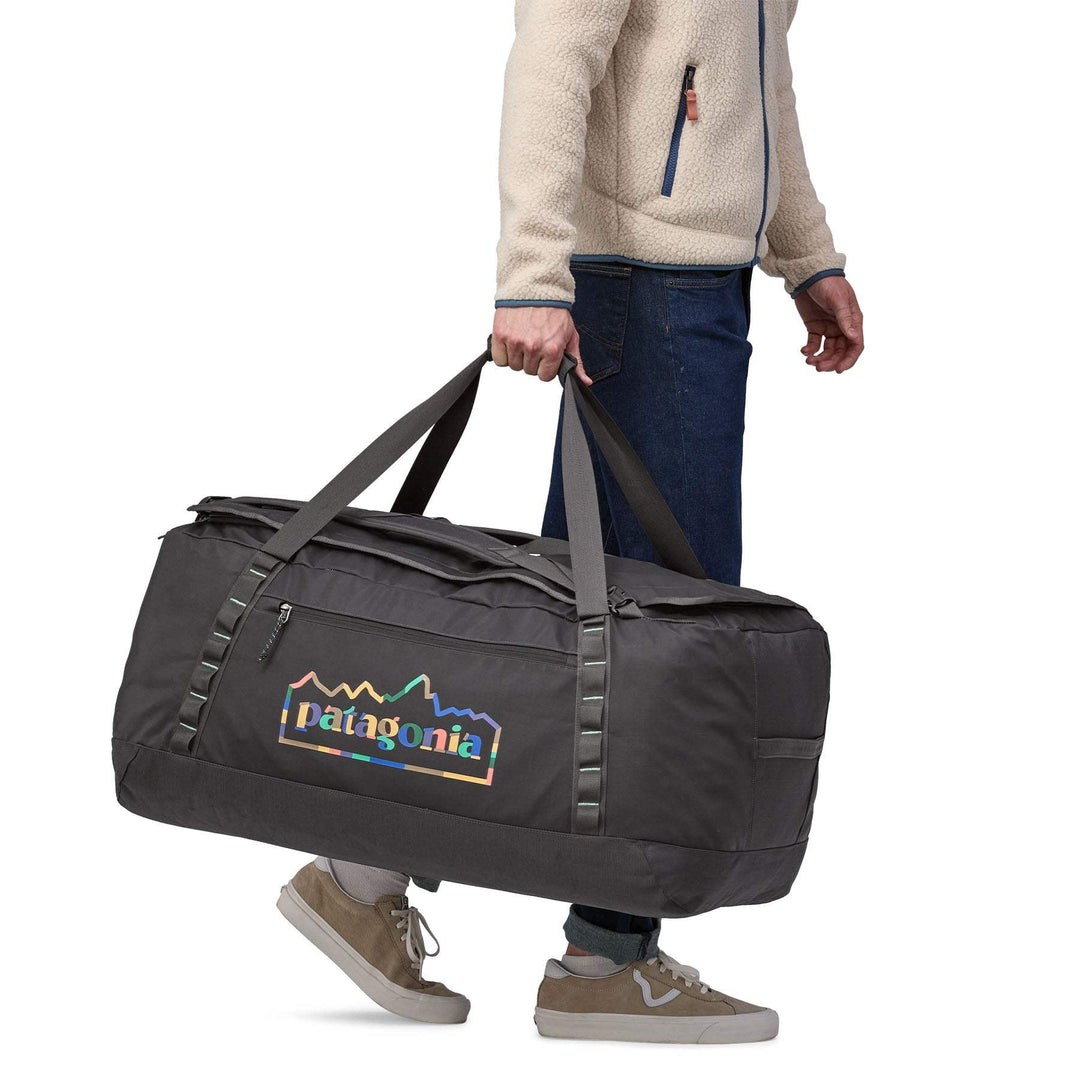 Black Hole Duffel 100L, durable and spacious travel bag with recycled materials, ergonomic straps, and 100-liter capacity.