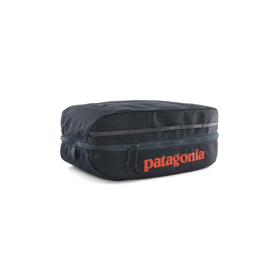 Black Hole Cube 14L in black with durable 100% recycled water-repellent fabric and zippered compartments.