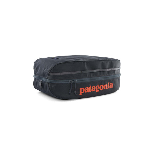 Black Hole Cube 14L in black with durable 100% recycled water-repellent fabric and zippered compartments.