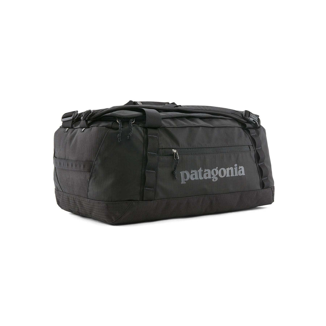 Black Hole Duffel 40L bag, durable and water-repellent, featuring recycled materials, ergonomic straps, and airline carry-on size compliance.