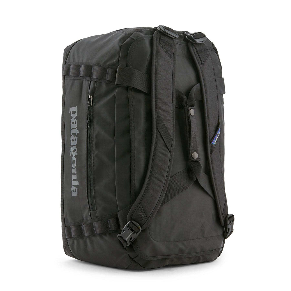Black Hole Duffel 40L in black, durable and water-repellent, with ergonomic removable straps and carry-on size compliance.