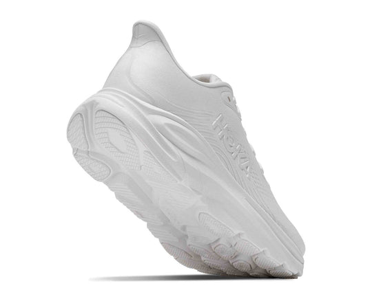 HOKA Clifton 11 donna White/White, vista inclinata con suola visibile