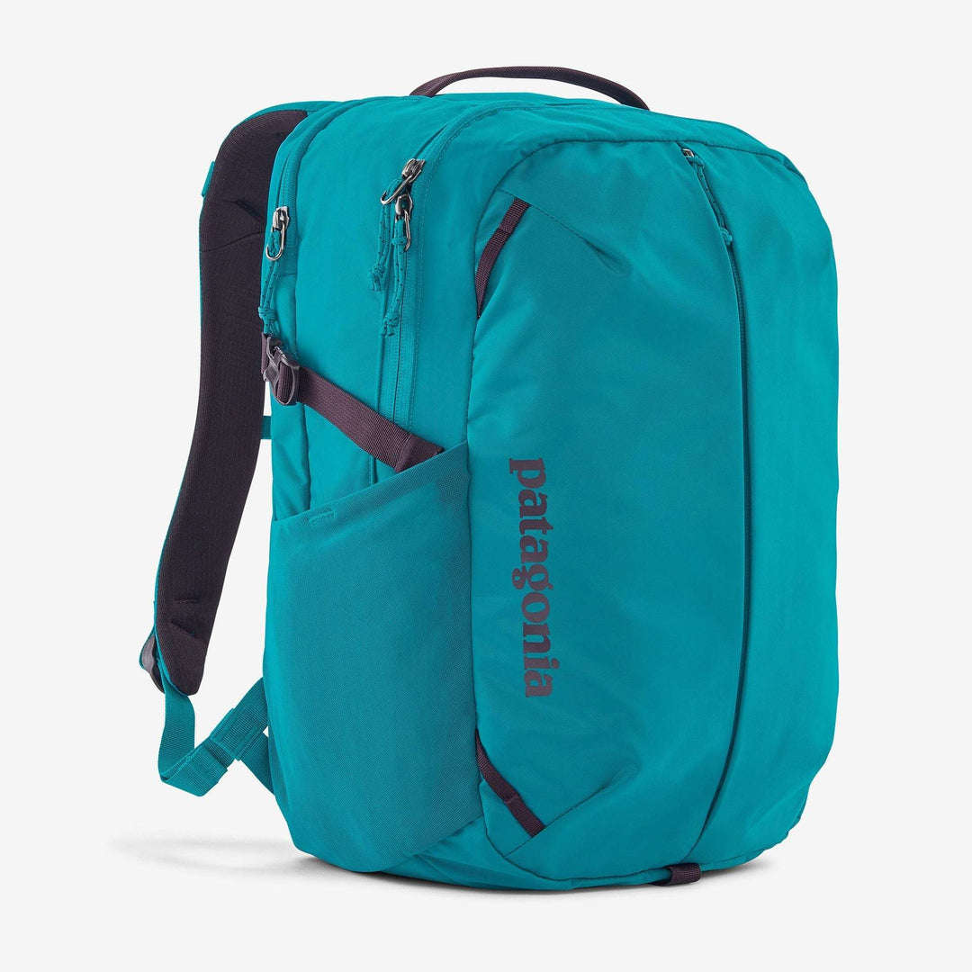 Teal Refugio Day Pack 26L with multiple compartments, recycled polyester material, and bike light clip.