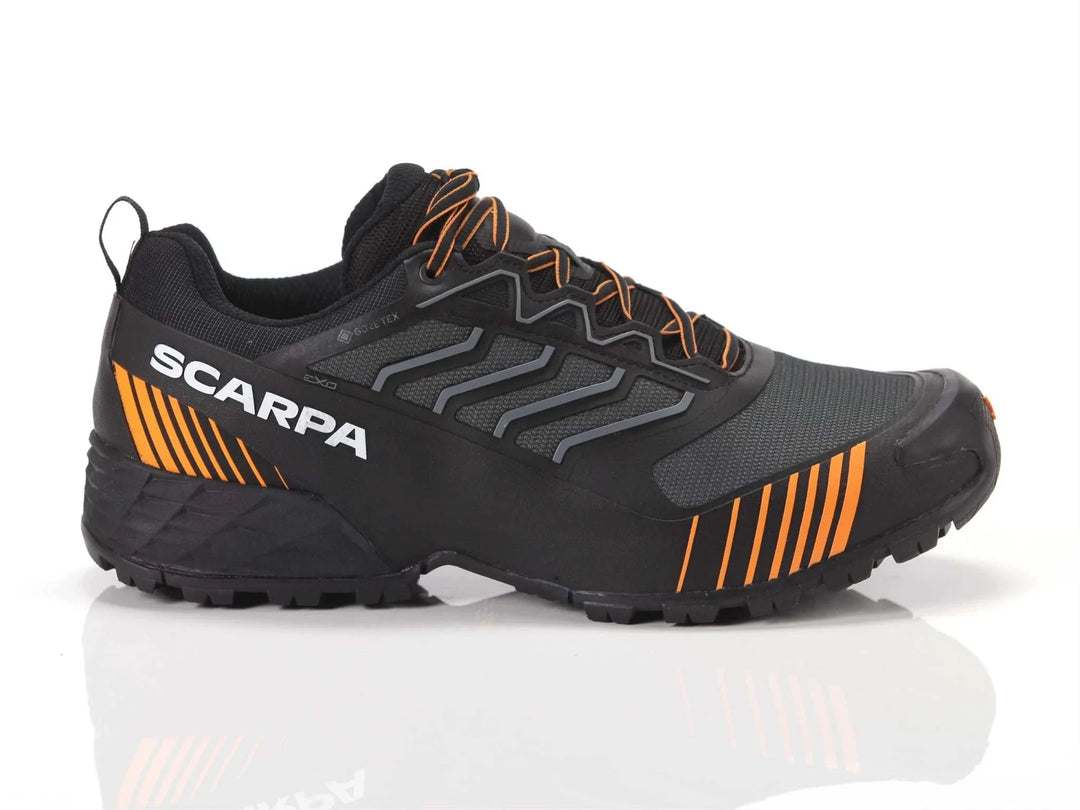 Ribelle Run XT GTX waterproof trail shoe with Gore-Tex, black-orange design, TPU band, durable sole for stability.