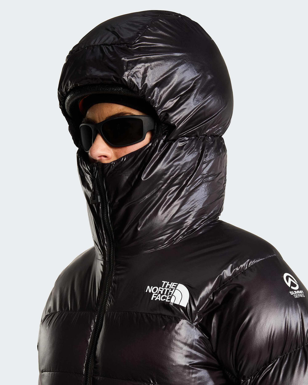 The North Face W Summit Pumori Down Parka - TNF Black - hood-up close-up on model