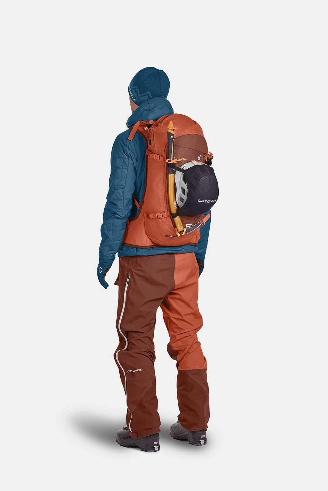 All-mountain ski backpack, Tour Rider 30, shown with technical outdoor gear and helmet attachment.