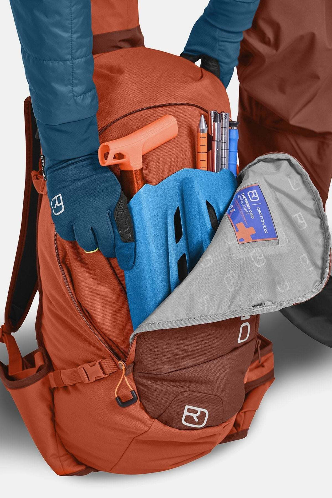 All-mountain ski touring backpack with emergency gear compartment and ergonomic design, ideal for long adventures.