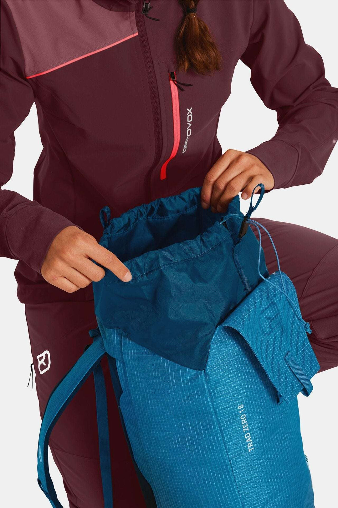 Lightweight and minimalist Trad Zero 18 backpack with internal silicone lining and attachment points, ideal for alpine climbing.