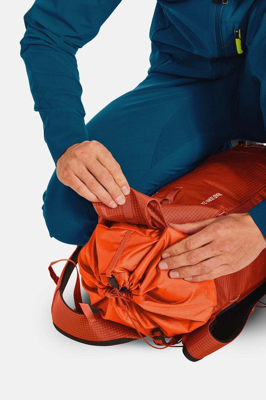 Lightweight, minimalist Trad Zero 24 climbing backpack being packed.